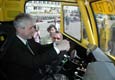Ptomn novini a ministr financ R (na fotografii) mli bhem slavnostnho odjezdu monost vyzkouet si posez v zvodnm voze TATRA JAMAL EVO III (3.5.2002)